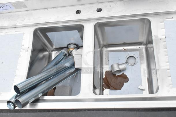 BRAND NEW SCRATCH AND DENT! Regency 600B22148213 48" x 21" underbar sink, two bowls, two 13" drainboards, minor dents.