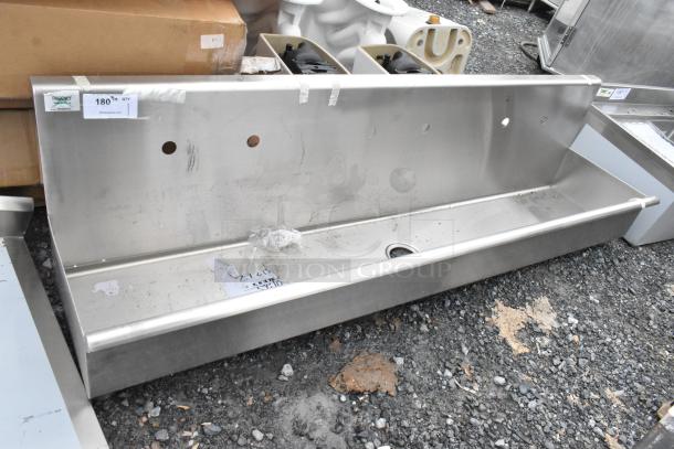 Regency 600HSMS1872 wall-mounted 72"x17.5" hand sink for three 8" faucets, new with scratches and dents visible.