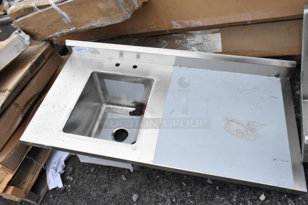 BRAND NEW Regency 600ST2448L stainless steel single bay sink with minor dents. Features spacious basin and drainboard.