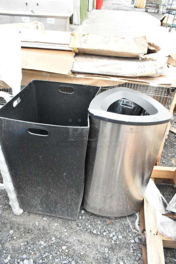 Two brand new 16x16x31 trash cans, including a black trash can shell and a stainless steel Lancaster model, marked 'scratch and dent.'