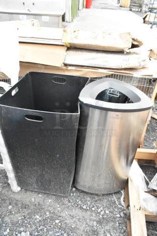 Two brand new 16x16x31 trash cans, including a black trash can shell and a stainless steel Lancaster model, marked 'scratch and dent.'