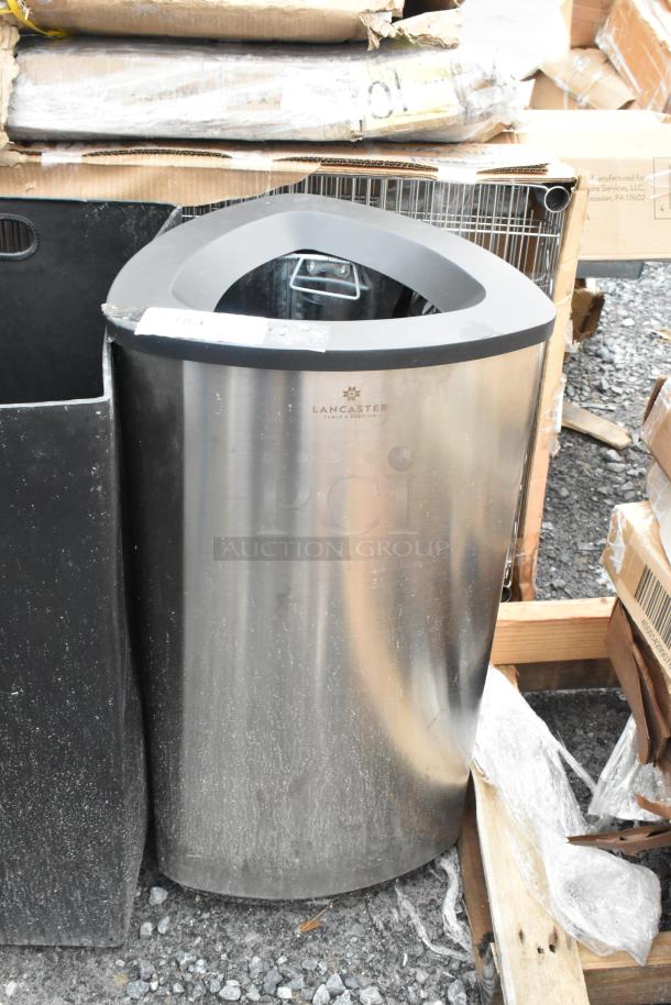 Brand new Lancaster trash can and shell, stainless steel, 16x16x31 inches. Scratch and dent condition.