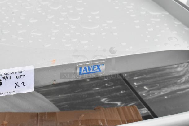 Gray metal 3-tier cart with "LAVEX" label, new condition, minor scratches. Auction lot quantity: 2 carts.