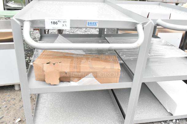 Gray metal 3-tier cart, brand new with minor scratches and dents. Includes one carton. Brand marking: AVEX.