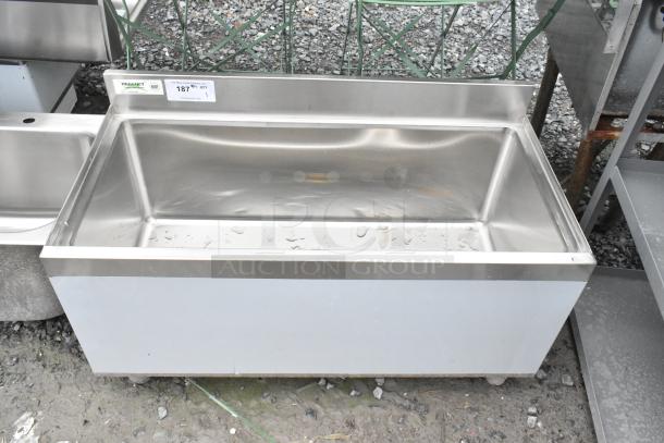 Brand new Regency 600IB1836 underbar ice bin, 18"x36", stainless steel, 119 lb capacity, minor scratches and dents visible.