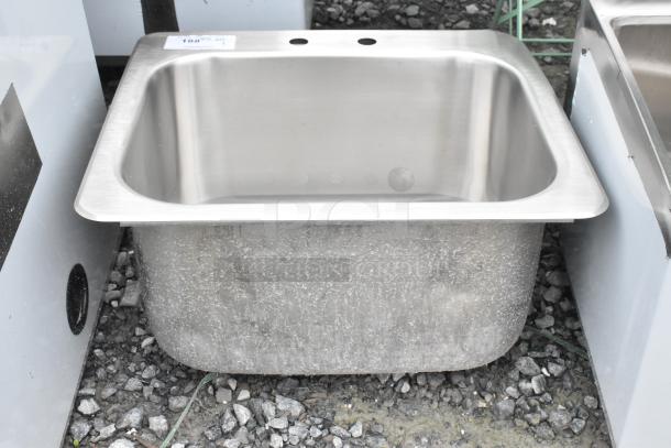 Brand new stainless steel single bay drop-in sink, minor scratches and dents, durable, ideal for kitchens or installations.