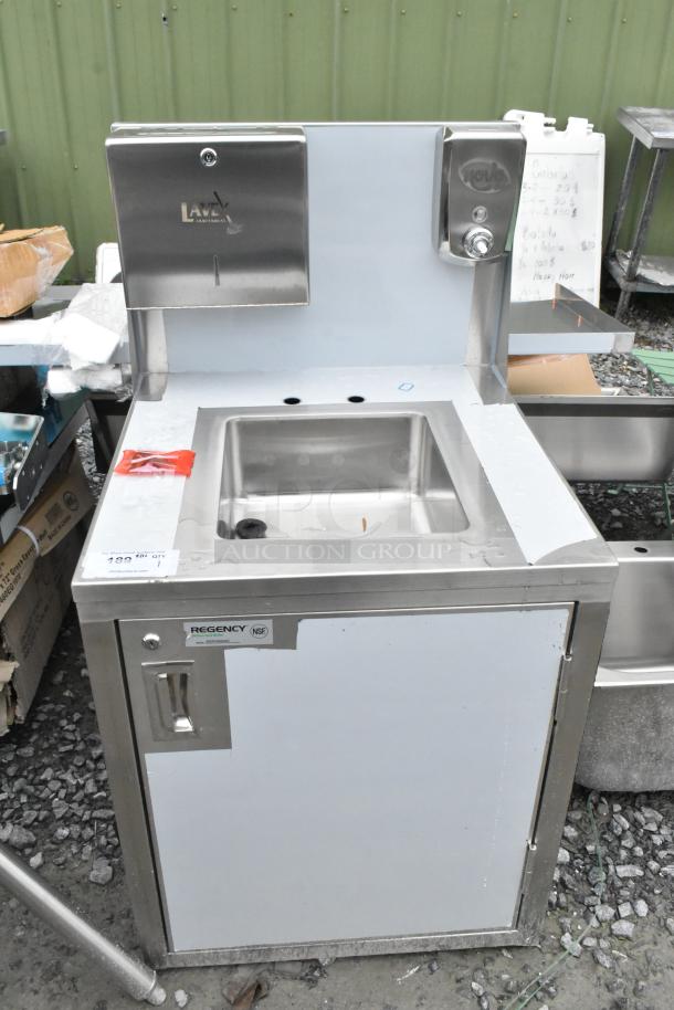 Brand new Regency 600PHS24HC portable hand sink cart. Includes single bowl, hot/cold faucets, and paper towel dispenser.