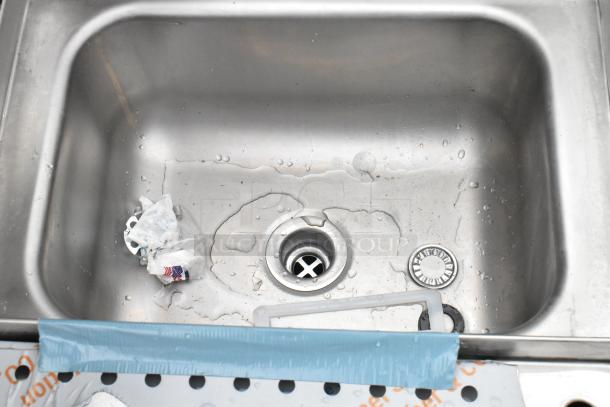 Advance Tabco PRCS-25-18 underbar hand sink with glass rinser, dipper well, and visible scratch. New condition, 25" x 18".
