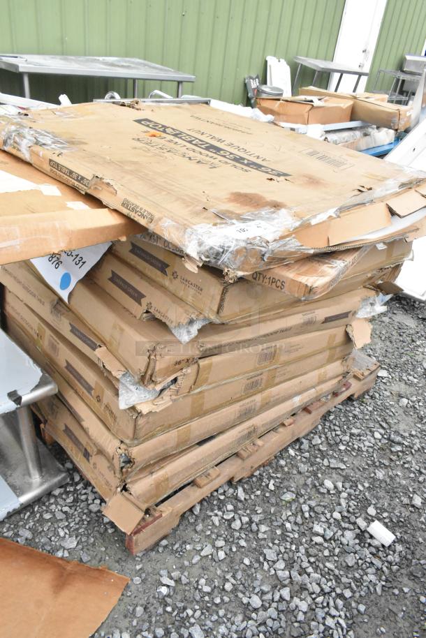 Stacked boxes of 8 Lancaster Table & Seating Alloy 36"x36" Emerald Green Outdoor Tables, scratch and dent condition.