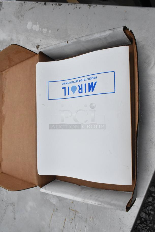 Brand new MirOil 55HD fryer oil filter machine in box, showing minor scratches, with branding visible on packaging.