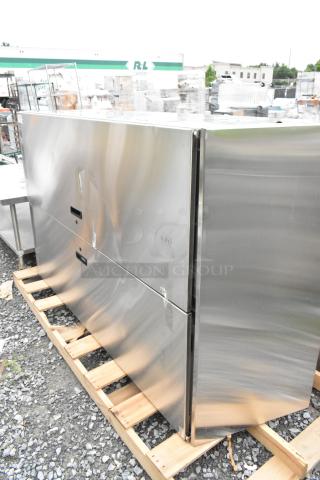 Alt text: Brand new Advance Tabco stainless steel 2-door cabinet with visible scratches and dents, on a pallet.