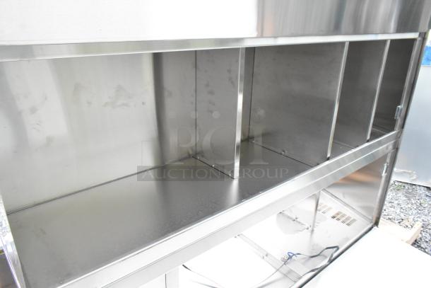 Brand new Advance Tabco stainless steel 2-door cabinet with slight scratches, spacious shelves, and durable construction.