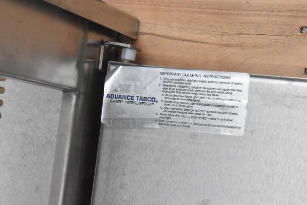 Advance Tabco stainless steel cabinet, brand new, 2 doors, visible scratch and dent. Cleaning instructions label attached.