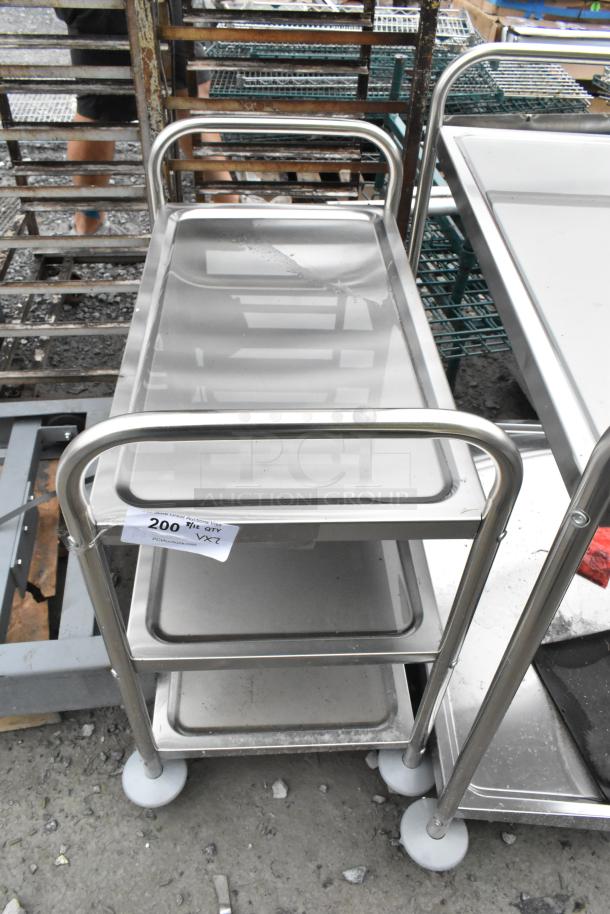 Stainless steel 3-tier cart with commercial casters, brand new with minor scratches. Tag reads "20 Qty - VX7."
