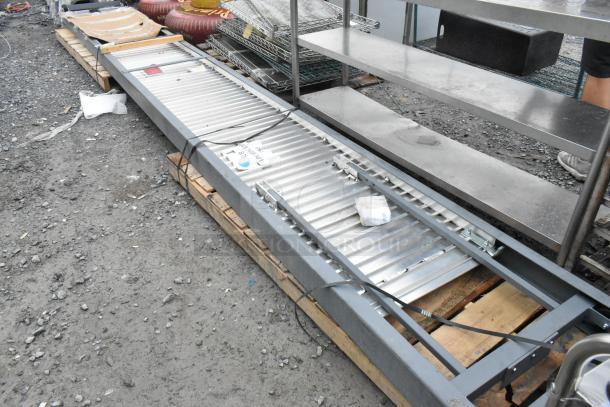 Brand new Magliner SR2416 2400 Series 16' Slider Ramp, resting on pallets, slight scratches, includes visible labels and ties.
