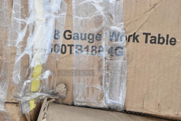 Box showing partially visible label of Regency 600TB1884G, indicating an 18-gauge work table with minor scratches and dents.