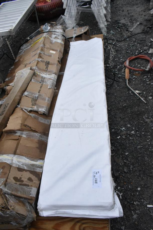 4 pack of brand new scratch and dent Regency stainless steel commercial work tables and wall shelves in original packaging.
