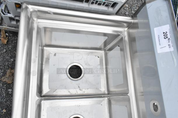 Brand new KoolMore SC121610-12R3 stainless steel 12x16x10 right 3-compartment sink. Visible scratches and dents. Auction tag 205.
