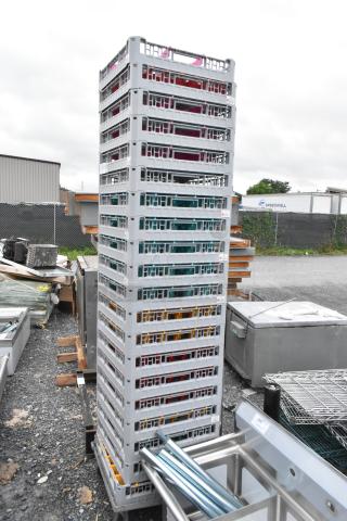 Lot of 20 Poly Dish Caddies stacked outdoors, grey with colored inserts, used condition, ideal for efficient dish storage.