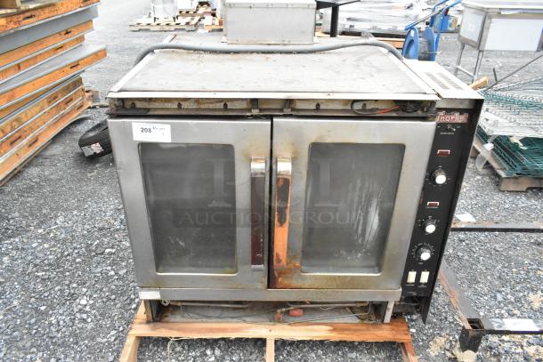 Vulcan Snorkel stainless steel commercial gas convection oven with view-through doors, metal racks, and thermostatic controls.