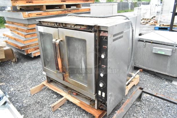 Vulcan Snorkel stainless steel gas convection oven, view-through doors, metal racks, thermostatic controls, used condition.