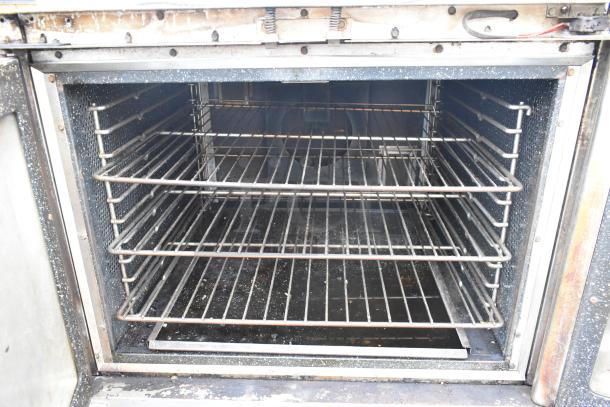 Vulcan Snorkel stainless steel commercial convection oven with view-through doors, metal racks, thermostatic controls, used condition.