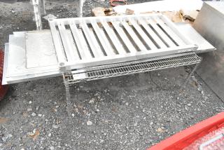 4 various items including a sturdy wire shelf and dunnage rack. Metal pieces visible with minor wear. Bid multiplier: 4x.