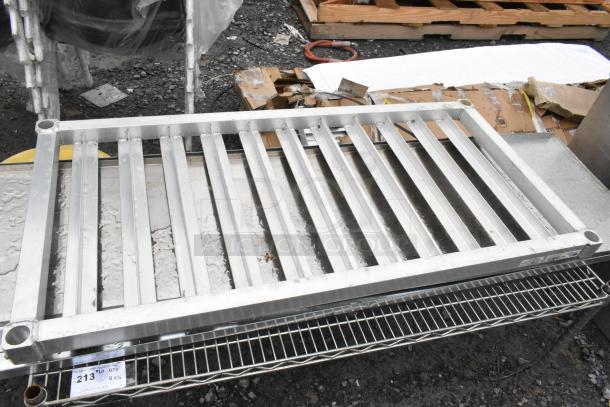 Metal wire shelf and dunnage rack, various metal pieces, shown with auction tag "213," indicating lot number.