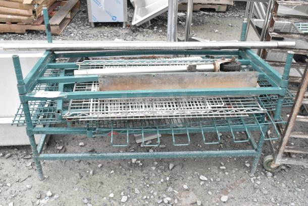 Lot of various items including a green metal dunnage style shelving unit. Used condition, visible wear and rust.