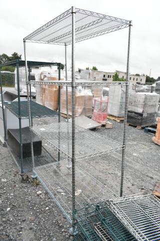 Metro chrome 4-tier wire shelving unit on commercial casters, excellent condition. Buyer must dismantle for shipping.