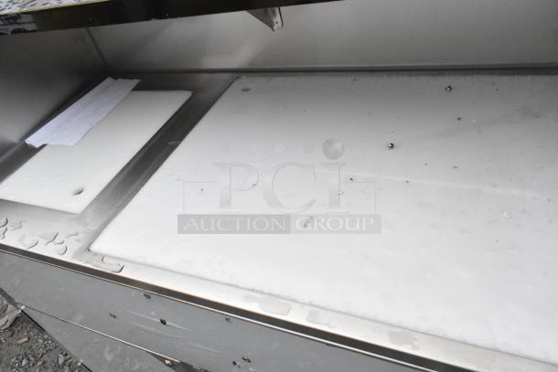 Regency 600PB48P 48" stainless steel bar with ice bin, cooler covers, and speed rails. Scratch and dent condition.