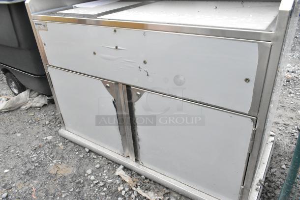 BRAND NEW Regency 600PB48P 48" stainless steel portable bar with Elixir Station, showing visible scratches and dents.