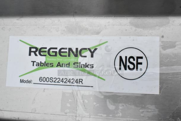 Regency 600S2242424R stainless steel 2-bay sink, right side drain board, new, scratch and dent, NSF certified label visible.