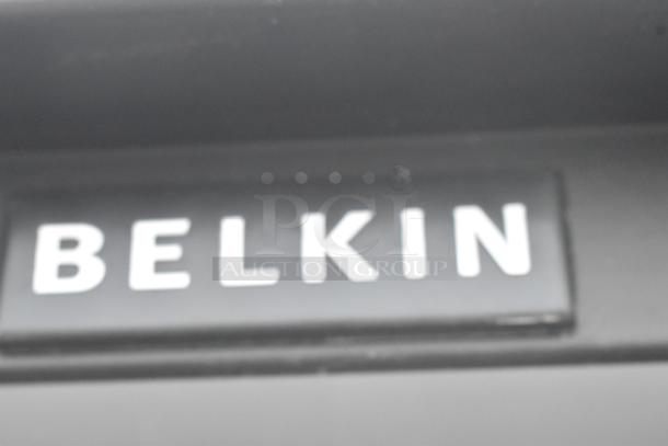 Black metal shelving unit, Belkin brand, sturdy construction, suitable for storage.