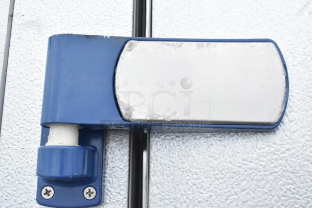 Mr Winter walk-in box handle detail, blue and silver, showing moderate wear.