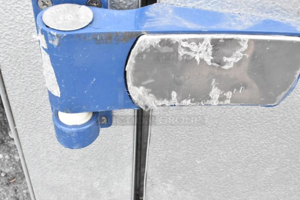 Mr Winter Walk In Box door hinge; features blue metal and frost buildup, indicating cold storage use.