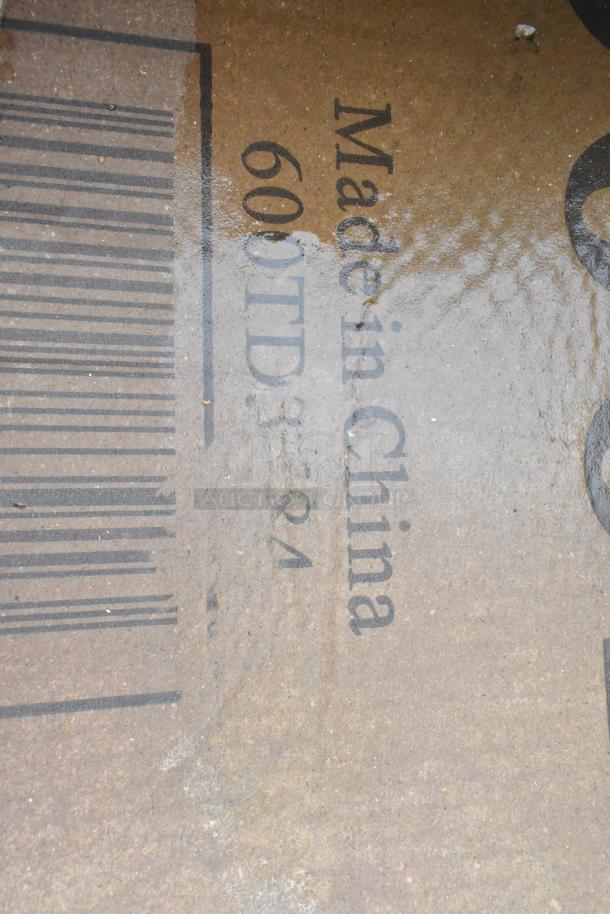 Cardboard box marked "Made in China 600TD3-21" with barcode, indicating new items inside.