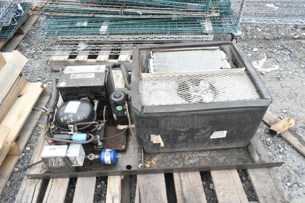 Copeland ASE26C4-IAA-959 commercial compressor, 115V, 1 phase, on a wooden pallet; visible labels indicate model and specifications.