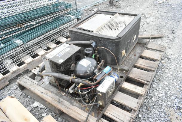 Copeland ASE26C4-IAA-959 commercial compressor, 115V, 1 phase, in used condition on a wooden pallet.