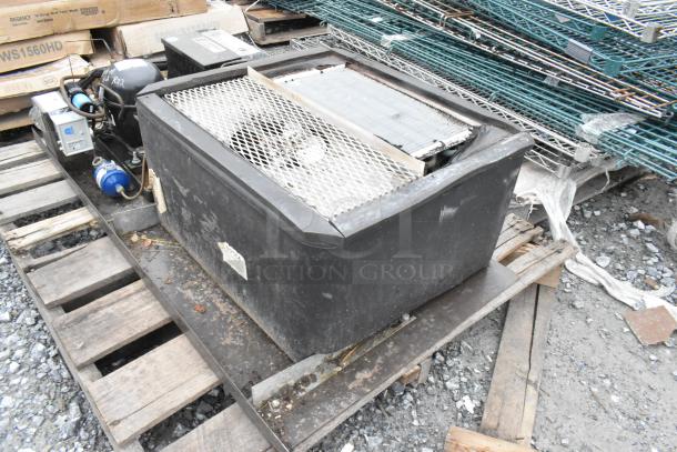 Copeland ASE26C4-IAA-959 commercial compressor on pallet, 115 volts, 1 phase. Shows wear with visible labels and wiring.