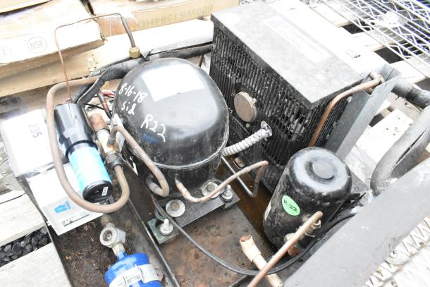 Copeland ASE26C4-IAA-959 commercial compressor, used, 115 volts, 1 phase, visible R22 markings and wiring.