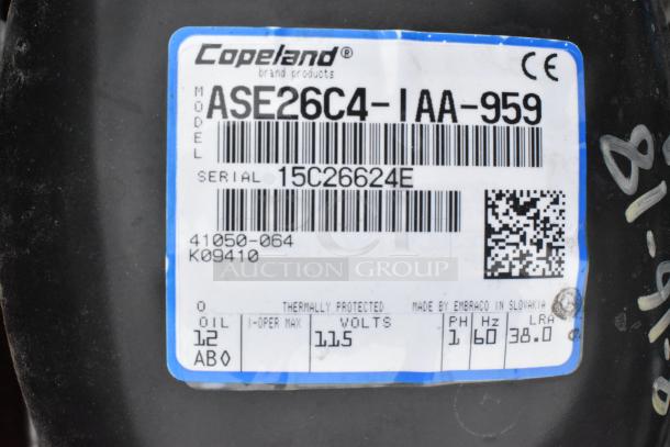Copeland ASE26C4-IAA-959 commercial compressor label, 115V, 1 phase, serial 15C26624E, Slovakia made.