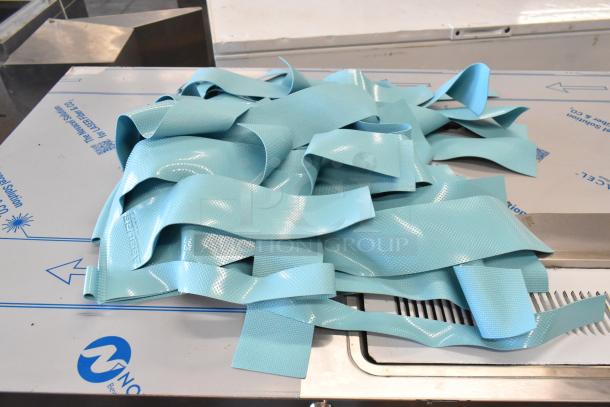 Assure Blue Dishwasher Ribbon Curtain, textured blue material, new condition, labeled "ASSURE", for industrial use.