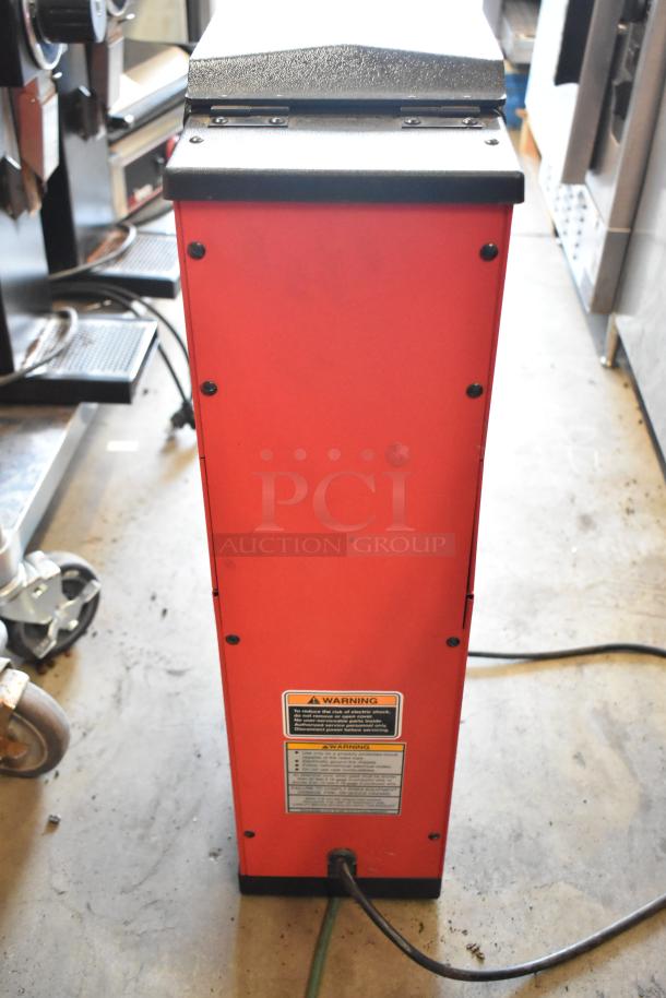 Bunn metal commercial countertop coffee bean grinder, red, 120 volts, tested and working. Warning labels visible.