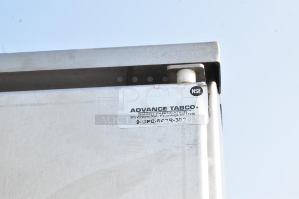 Brand new Advance Tabco stainless steel cabinet with mop sink, model 9-OPC-84DR-300. Scratch and dent condition. NSF label visible.
