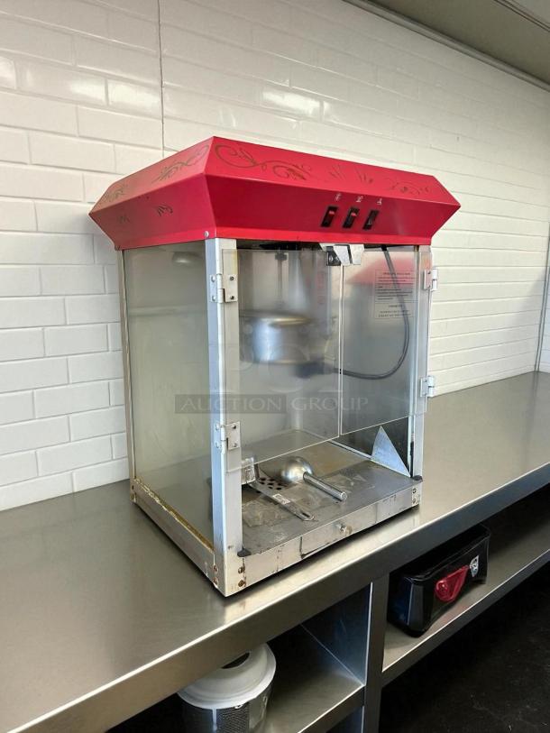 Elite Deluxe EPM-400 popcorn popper, 8-oz capacity, in good condition. Features red top, tested and working. Model label visible.