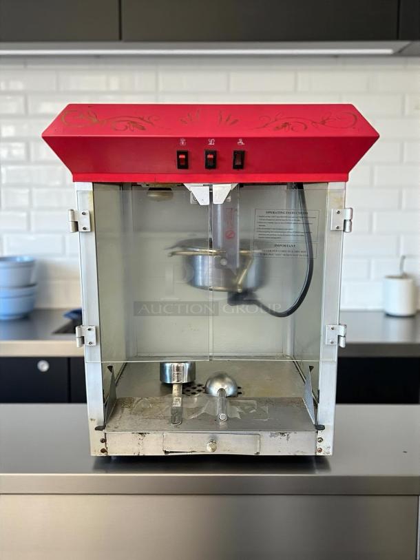 Elite Deluxe EPM-400 popcorn popper machine, 8 oz capacity, good condition, tested and working, visible controls and instructions.