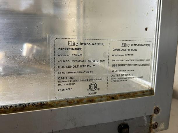 Elite Deluxe EPM-400 Popcorn Popper, 8 oz capacity, 115v, tested and working, good condition. Labels show model and usage warnings.