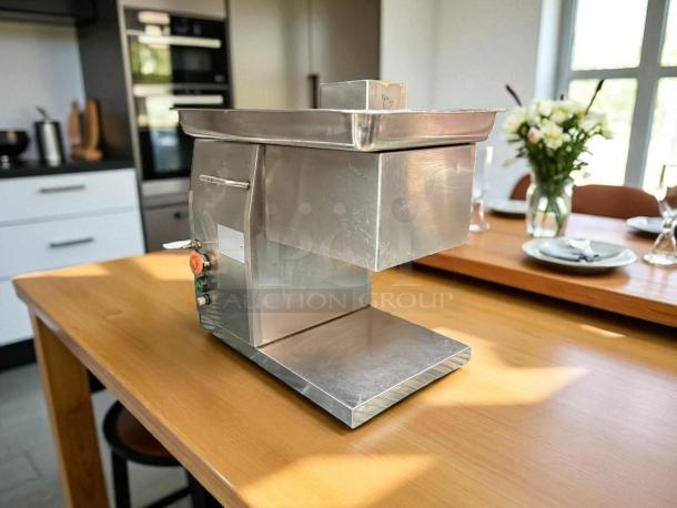 Countertop meat grinder, 115v, 12"W x 16"D x 15"H, stainless steel, great condition, fully tested, control buttons visible.