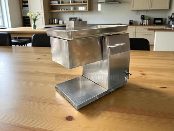Countertop 115v meat grinder, 12"W x 16"D x 15"H, in great condition, fully tested and working, stainless steel finish.